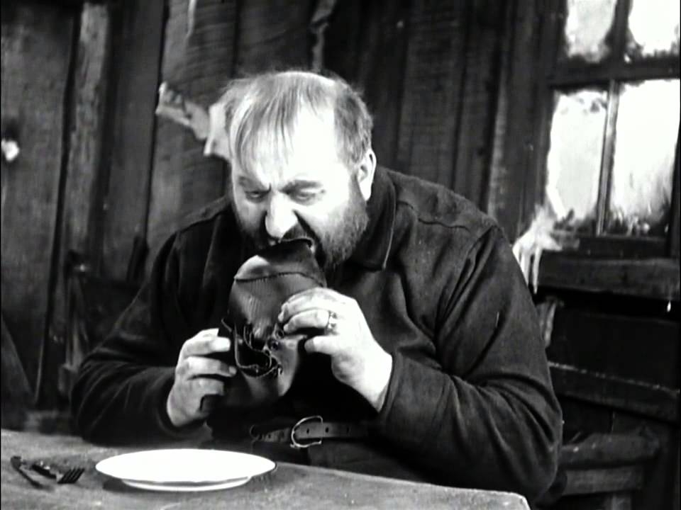 Charlie Chaplin Movie Image of Man Eating Shoe