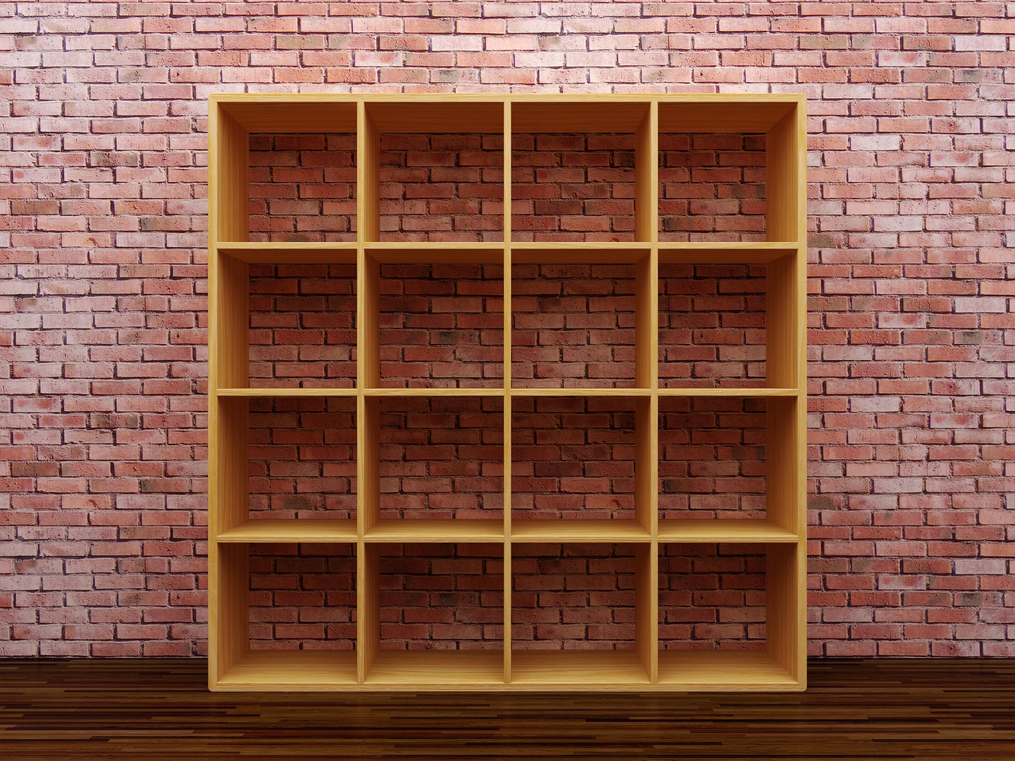 empty bookshelf against brick wall