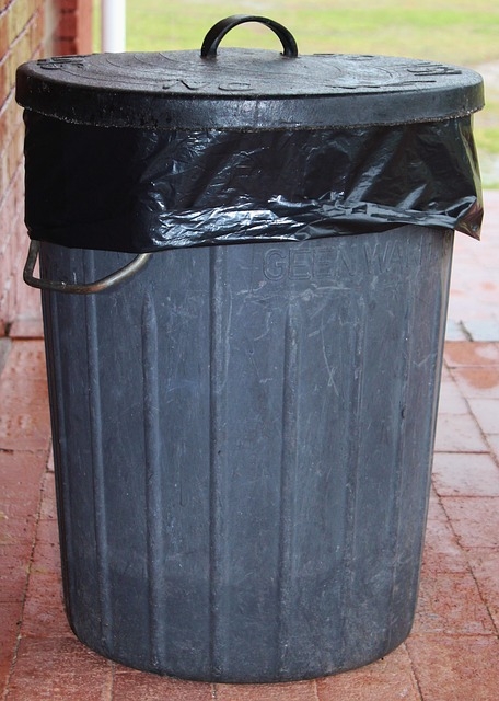 metal garbage can with black plastic liner