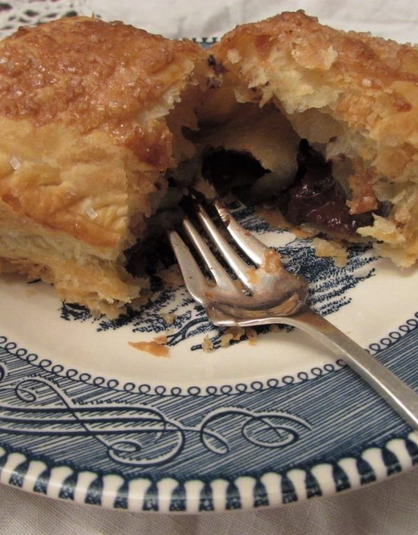 Cut Chocolate Pastry On Plate