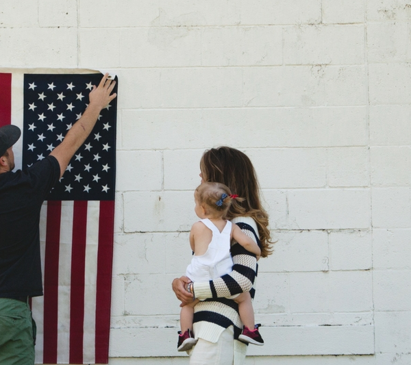Father Mother and Child With American Flag for Memorial Day