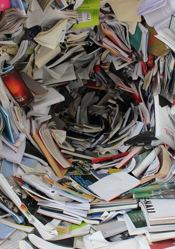 chaotic swirling pile of books