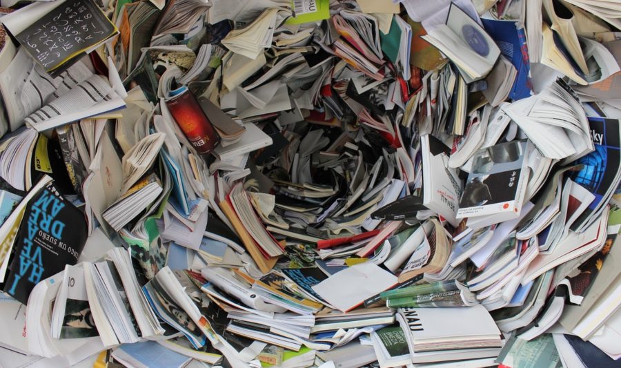 chaotic swirling pile of books
