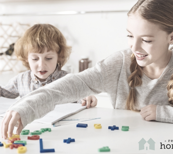 siblings playing together learning math